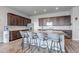 Spacious kitchen features granite countertops, a large island, and stainless steel appliances at 16122 Emporia Way, Brighton, CO 80602