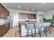 Spacious kitchen with a large island, granite countertops, and seating for four at 16122 Emporia Way, Brighton, CO 80602