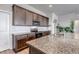 Open kitchen featuring granite countertops, stainless steel appliances, and wood cabinets at 16122 Emporia Way, Brighton, CO 80602