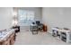 Office with a fireplace, a work area with desks, and soft neutral colors at 16122 Emporia Way, Brighton, CO 80602