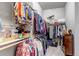 Walk-in closet features ample hanging space and custom organization at 16122 Emporia Way, Brighton, CO 80602