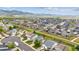 Wide aerial of the community showcasing houses and mountains in the background at 9625 Bighorn Way, Littleton, CO 80125