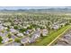 Stunning aerial shot of a well-planned residential area nestled against scenic mountain views at 9625 Bighorn Way, Littleton, CO 80125