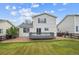 Back exterior of the home featuring a deck with a yard and fence at 9625 Bighorn Way, Littleton, CO 80125