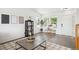 Bright entryway showcases stylish decor, hardwood floors, and plenty of natural light from large windows at 9625 Bighorn Way, Littleton, CO 80125