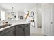 Open-concept living space with kitchen featuring gray cabinets, quartz countertops and stainless appliances at 9625 Bighorn Way, Littleton, CO 80125
