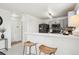 Modern kitchen features stainless appliances, gray cabinetry, quartz countertops, and a convenient breakfast bar at 9625 Bighorn Way, Littleton, CO 80125