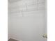 Walk-in closet featuring white walls, shelving, and neutral carpet flooring at 9625 Bighorn Way, Littleton, CO 80125