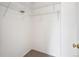 Walk-in closet featuring white walls, shelving, and neutral carpet flooring at 9625 Bighorn Way, Littleton, CO 80125