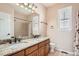 Well-lit bathroom with double sinks, a granite countertop, and tiled flooring at 3391 Prairie Vista Dr, Castle Rock, CO 80109
