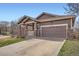 A well maintained home exterior with a two car garage at 3391 Prairie Vista Dr, Castle Rock, CO 80109