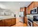 Modern kitchen featuring stainless steel appliances, granite countertops, and ample cabinet space at 3391 Prairie Vista Dr, Castle Rock, CO 80109