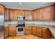 Updated kitchen showcasing granite countertops and stainless steel oven at 3391 Prairie Vista Dr, Castle Rock, CO 80109