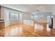 Open living room featuring hardwood floors, a fireplace, and plenty of natural light at 3391 Prairie Vista Dr, Castle Rock, CO 80109