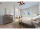 Comfortable main bedroom with dresser and a view into a bathroom, providing a relaxing retreat at 3391 Prairie Vista Dr, Castle Rock, CO 80109
