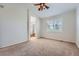 Bright and spacious main bedroom with a ceiling fan and an en-suite bathroom at 3391 Prairie Vista Dr, Castle Rock, CO 80109