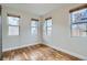 Cozy bedroom with hardwood floors and multiple windows providing ample natural light at 3643 Zuni St, Denver, CO 80211