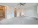 Spacious bedroom featuring a ceiling fan and multiple doorways leading to closets and other areas at 3643 Zuni St, Denver, CO 80211