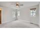 Bright bedroom with natural light from multiple windows and plush carpeting at 3643 Zuni St, Denver, CO 80211