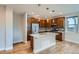 Well-equipped kitchen with stainless steel appliances, a center island, and wood cabinetry at 3643 Zuni St, Denver, CO 80211