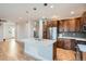 Stylish kitchen with a center island, stainless steel appliances, and seamless transition to living area at 3643 Zuni St, Denver, CO 80211