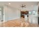 Open-concept living space featuring hardwood floors flowing into a modern kitchen with an island at 3643 Zuni St, Denver, CO 80211