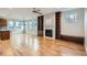 Spacious living room boasts hardwood floors, a fireplace, built-in shelves, and lots of natural light at 3643 Zuni St, Denver, CO 80211