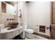 Rustic powder room featuring a unique vessel sink and stone countertop, blending natural textures and tones at 22759 Mountain Spirit Way, Indian Hills, CO 80454