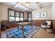 Charming office space with custom wainscoting, coffered ceiling, and ample natural light at 22759 Mountain Spirit Way, Indian Hills, CO 80454