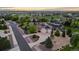 Aerial view of the home with lush landscaping, close to golf course and other neighborhood homes at 8211 E 128Th Pl, Thornton, CO 80602