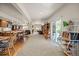 Finished basement featuring kitchenette, living space and sliding glass door at 8211 E 128Th Pl, Thornton, CO 80602