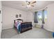 Cozy bedroom featuring bay window, gray carpet and ceiling fan at 8211 E 128Th Pl, Thornton, CO 80602