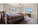 Bright bedroom with large windows, a cozy bed, and classic furniture for a comfortable retreat at 8211 E 128Th Pl, Thornton, CO 80602