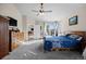 Cozy bedroom boasting sliding glass doors, gray carpet, and ceiling fan at 8211 E 128Th Pl, Thornton, CO 80602