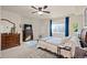 Relaxing bedroom with soft lighting, decorative dresser, and a comfortable bed for a serene experience at 8211 E 128Th Pl, Thornton, CO 80602