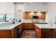 Modern kitchen with wood cabinets, stainless steel appliances, and lots of countertop space at 8211 E 128Th Pl, Thornton, CO 80602