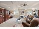 Cozy living room features a fireplace, plush seating, and built-in shelving at 8211 E 128Th Pl, Thornton, CO 80602