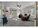 Spacious home office with multiple windows providing natural light and a neutral color palette at 8211 E 128Th Pl, Thornton, CO 80602