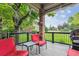 Inviting back deck featuring outdoor seating and a grill at 3413 Boxelder Dr, Longmont, CO 80503