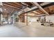 Large, unfinished basement with exposed ceiling and concrete floor at 3413 Boxelder Dr, Longmont, CO 80503