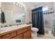Full bathroom with a single sink vanity and a shower-tub combo at 3413 Boxelder Dr, Longmont, CO 80503