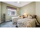 Comfortable bedroom with twin beds, soft carpeting and natural light at 3413 Boxelder Dr, Longmont, CO 80503