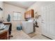 Functional laundry room featuring a washer, dryer, storage cabinets, and a sink, providing convenience and organization at 3413 Boxelder Dr, Longmont, CO 80503