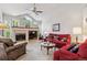 Living room with vaulted ceilings, fireplace, and lots of natural light at 3413 Boxelder Dr, Longmont, CO 80503