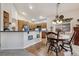 Open floor plan shows kitchen and dining area with seamless flow to living area at 3413 Boxelder Dr, Longmont, CO 80503
