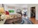 Bright main bedroom showcasing hardwood floors, natural light, and a walk-in closet at 3413 Boxelder Dr, Longmont, CO 80503