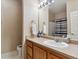 Bathroom with shower, vanity, and toilet at 5703 N Gibralter Way # 204, Aurora, CO 80019