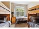 Shared bedroom with two sets of bunk beds and a window at 5703 N Gibralter Way # 204, Aurora, CO 80019