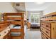 Shared bedroom with two sets of bunk beds and a window at 5703 N Gibralter Way # 204, Aurora, CO 80019