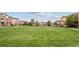 Community green space with pathways and buildings at 5703 N Gibralter Way # 204, Aurora, CO 80019
